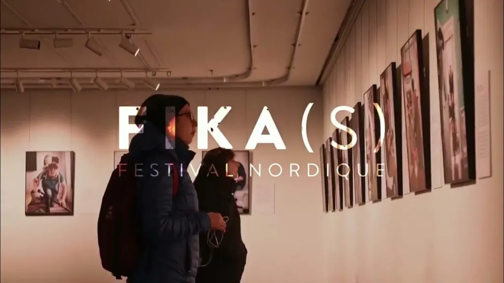 Visitors browsing photography exhibits at the FIKA(S) Nordic Festival gallery